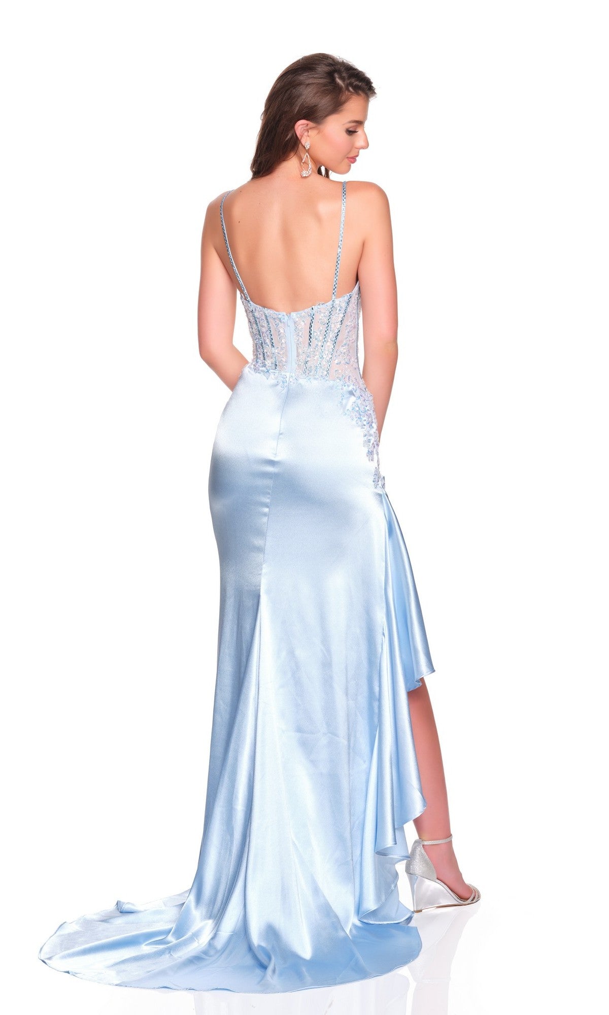 A woman models the Dave and Johnny 12807 Long Prom Dress—light blue satin with thin straps, a corset bodice, and a low back—standing on a white background facing away from the camera.